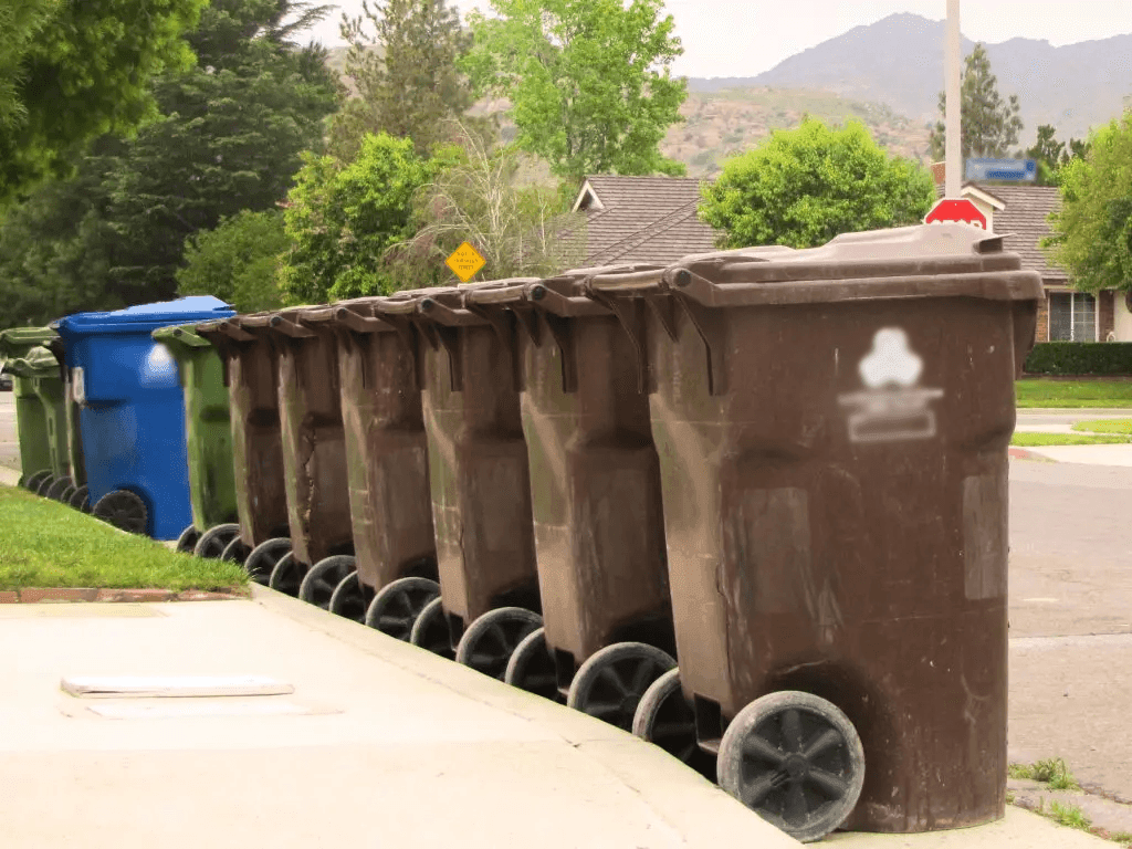 equine manure waste bins curbside ready for hauling pick up